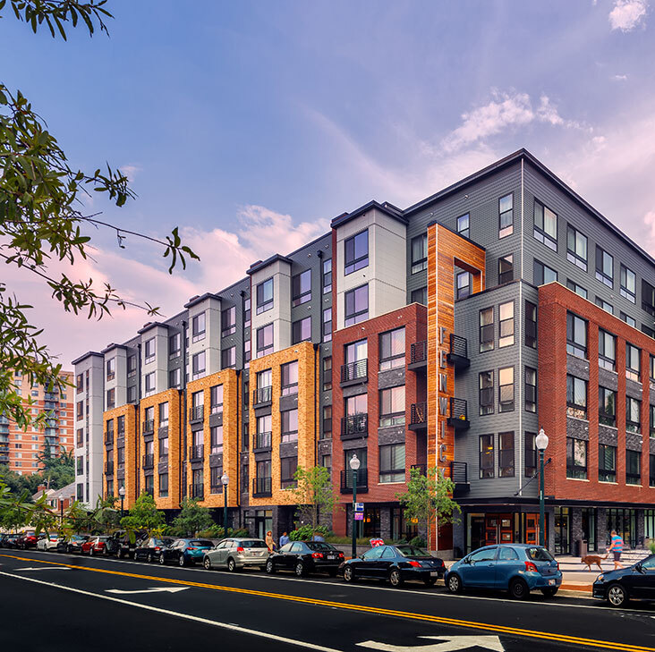 Building exterior of the Fenwick apartments at dusk