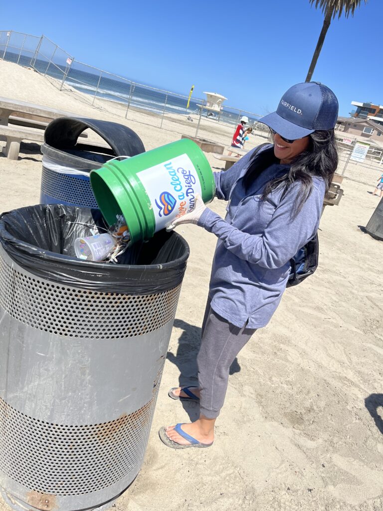 Fairfield associates cleans beach on Earth Day by picking up litter