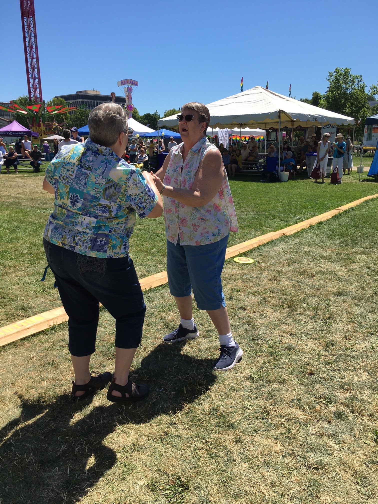 Then they take a break at Lakefair 50+ Senior Day to enjoy the music.