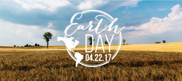 Earth day 2017 logo over a golden field on a sunny day