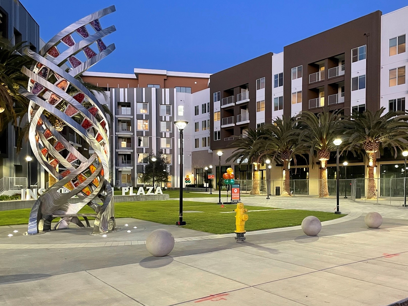 An outdoor sculpture and walking path at the Embark Apartments.