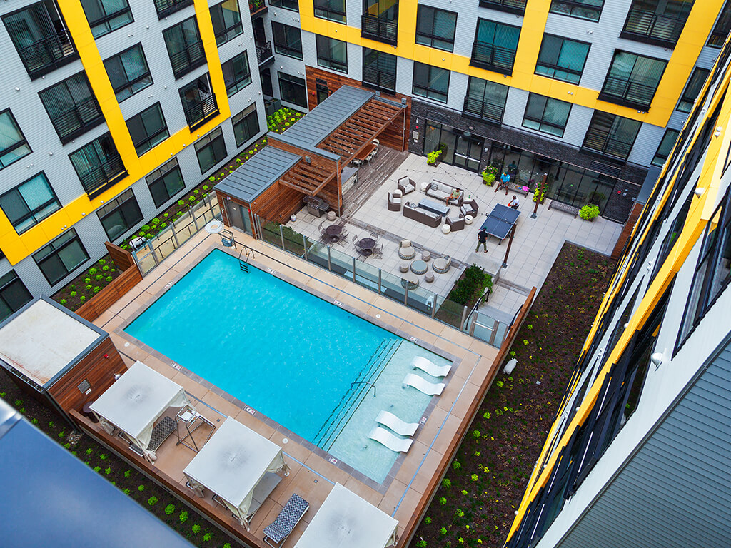 Aerial view of courtyard pool and grill.