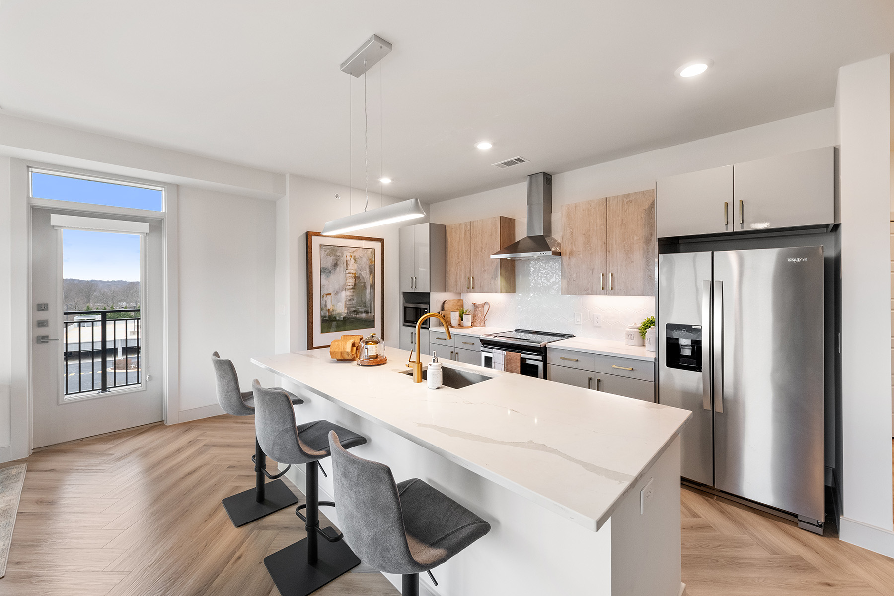 A large kitchen with a granite kitchen island at one of Fairfield's new properties.