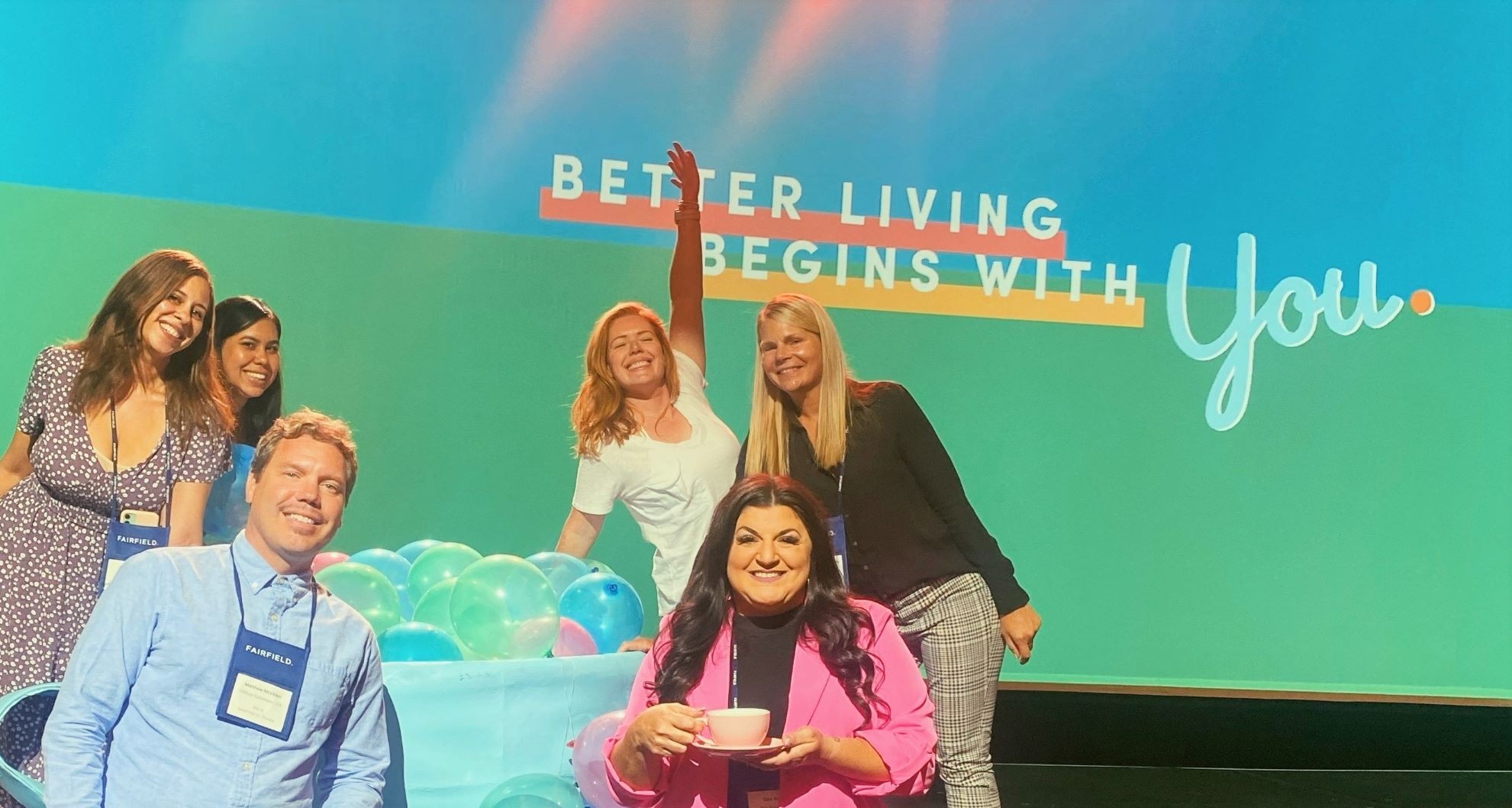 A group of Fairfield associates on stage at the Better Living Begins with YOU conference