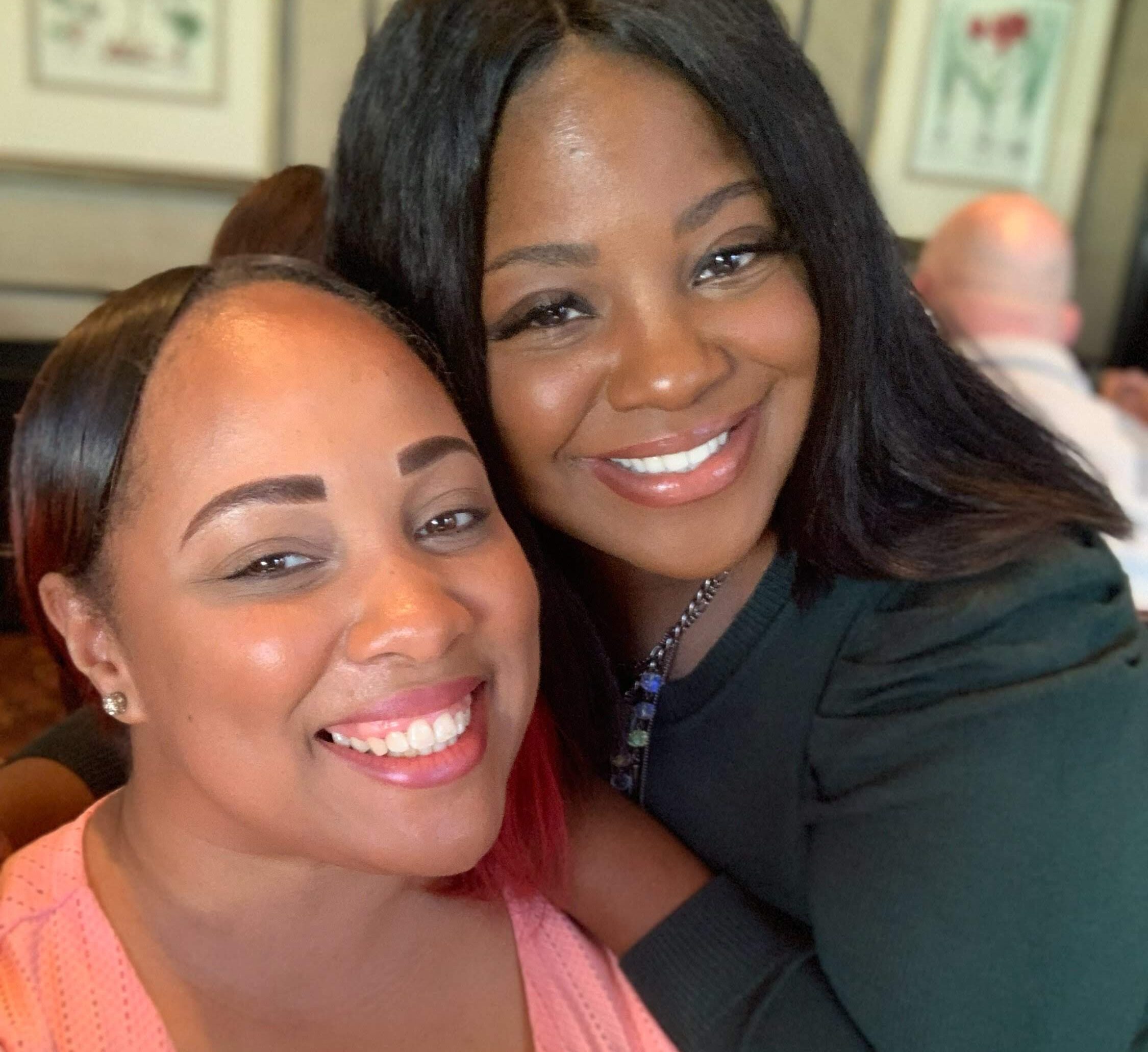 Two Fairfield associates smile for a selfie together.