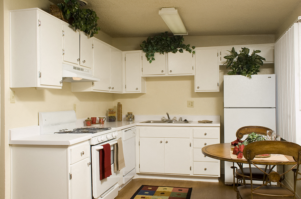 A white, airy kitchen at the Walden Glen Apartments in Buena Park, California.