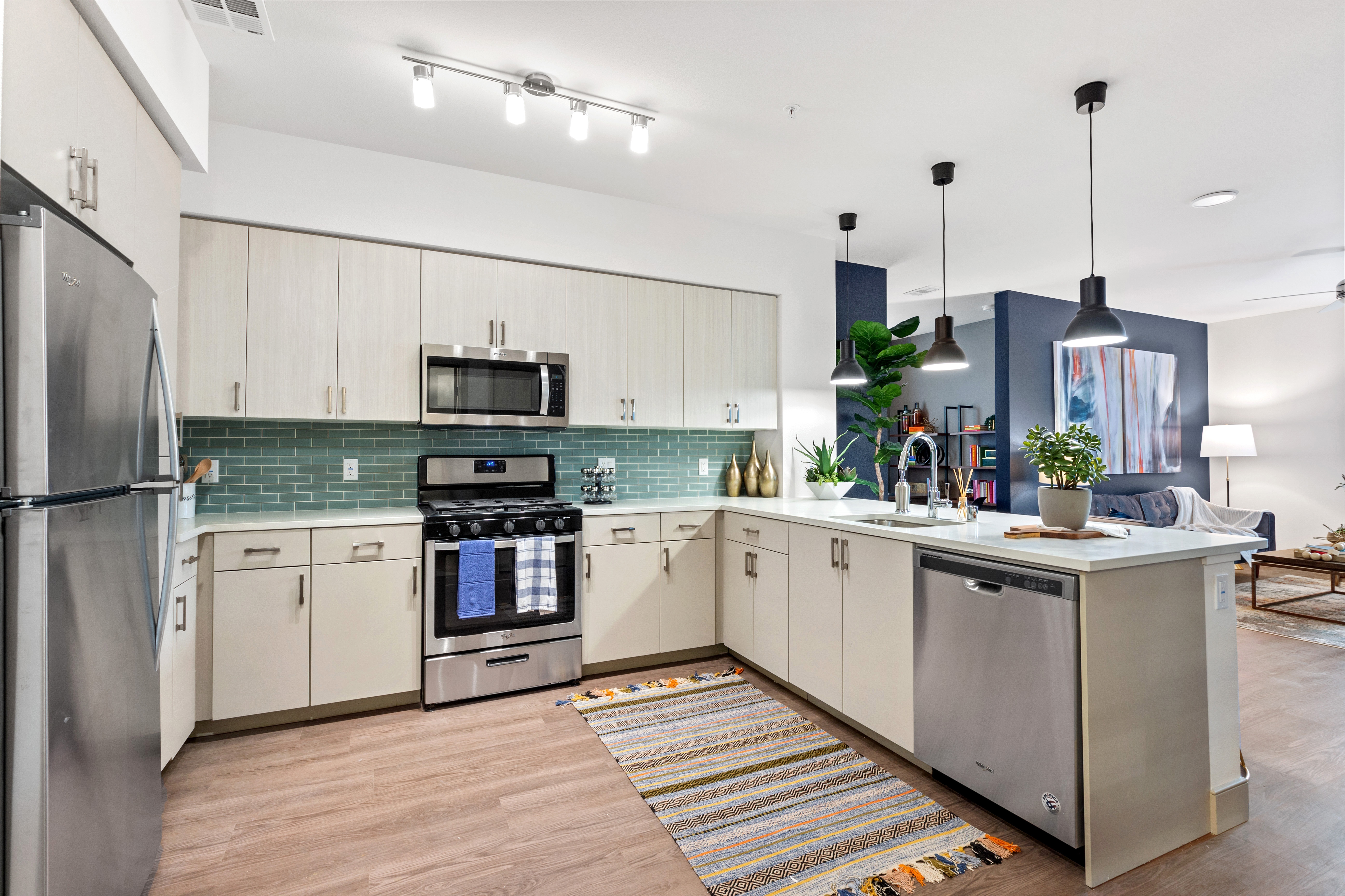 A modern kitchen with hardwood floors at a Fairfield property.