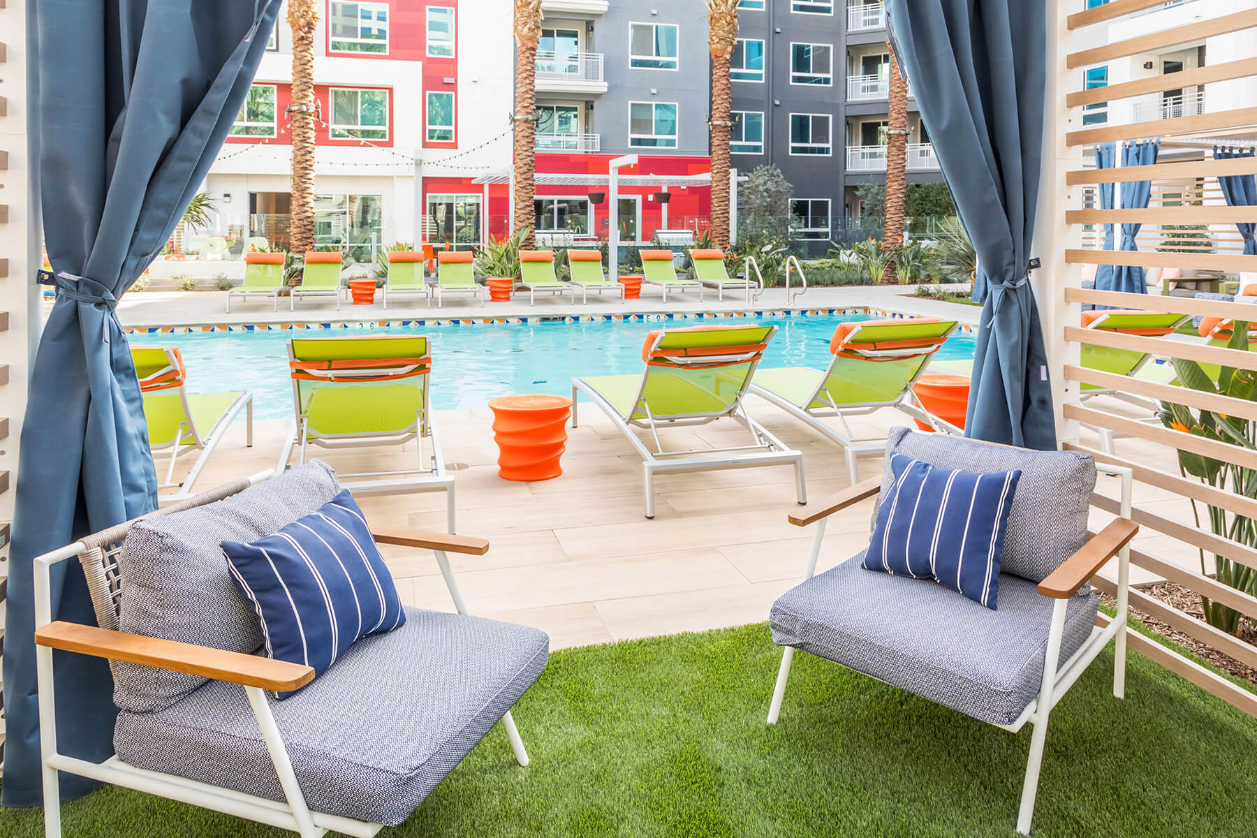 Poolside cabana lounge seating on a sunny day.