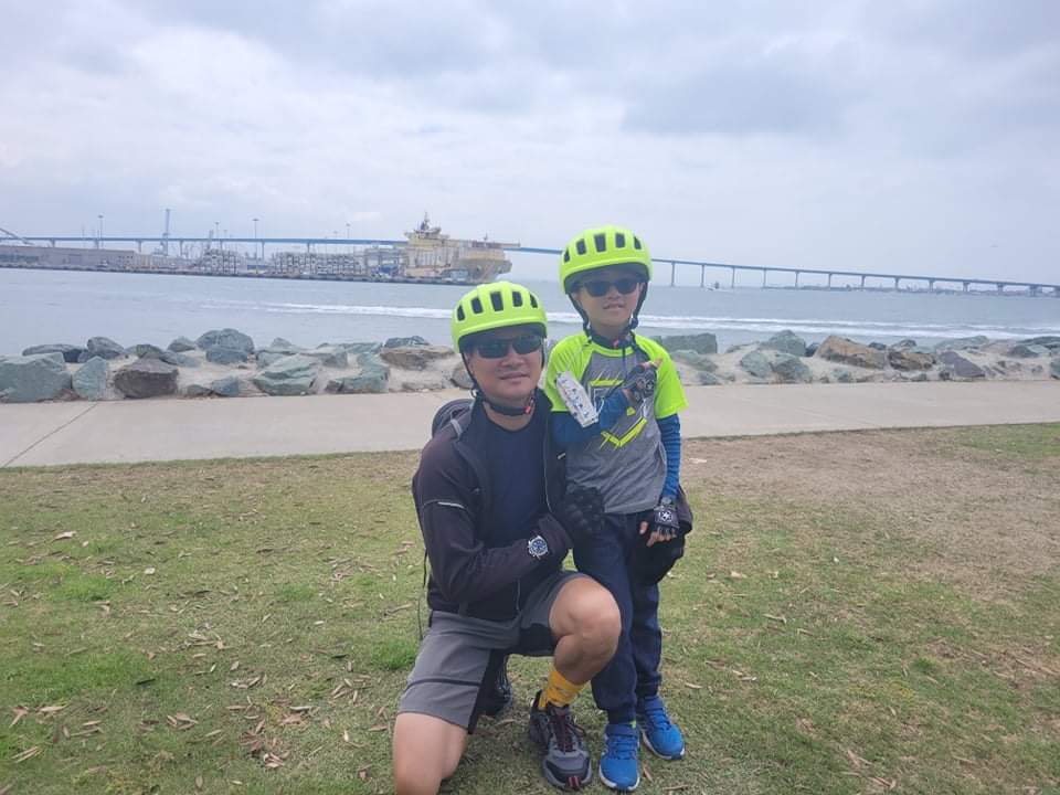 Peter and his son bike in coronado as he grows his career at Fairfield