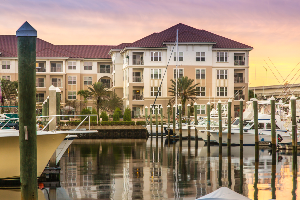 Harbortown exterior at golden hour viewed from across the boat dock