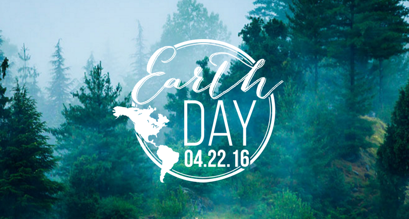 Earth day 2016 logo over a backdrop of trees in a haze