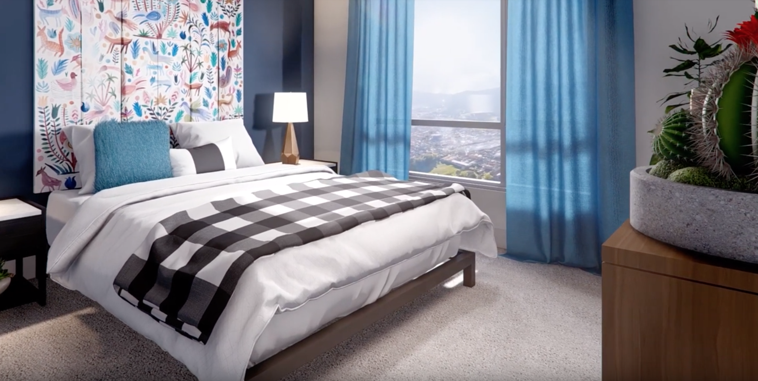 A brightly decorated bedroom at the Sandy28 Apartments in Portland.